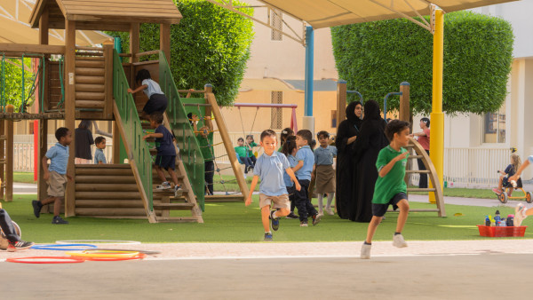 many students outside WellSpring Private School learning and playing