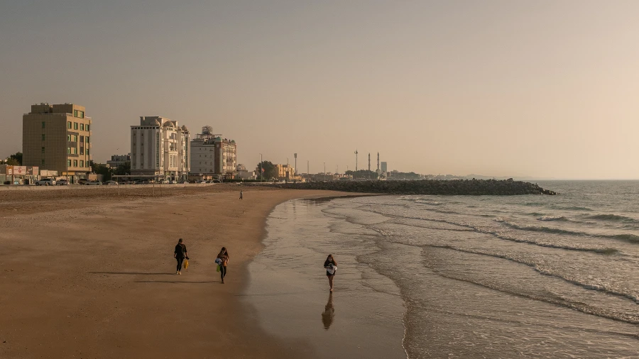 Women walking on beach near WellSpring Private School Secondary school